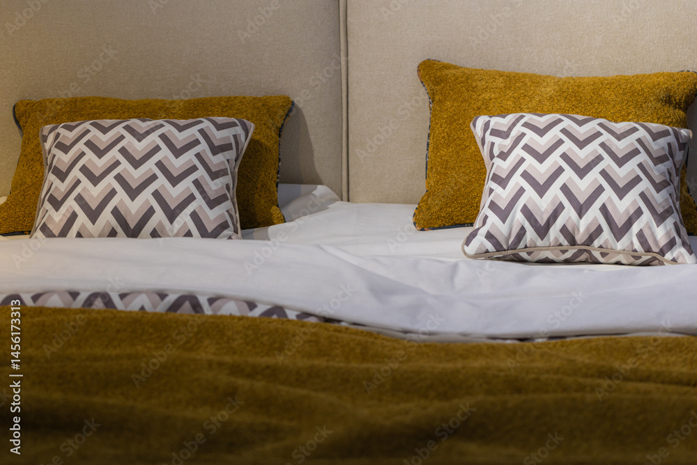 Closeup of cushions on bed