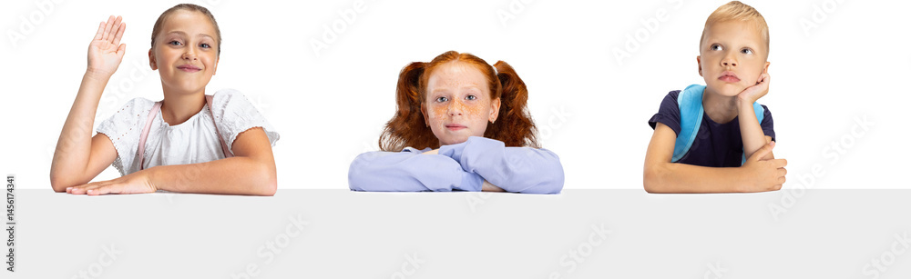 Three thoughtful school children sitting at desk expressing interest curiosity and boredom isolated on transparent background. Concept of childhood, early development