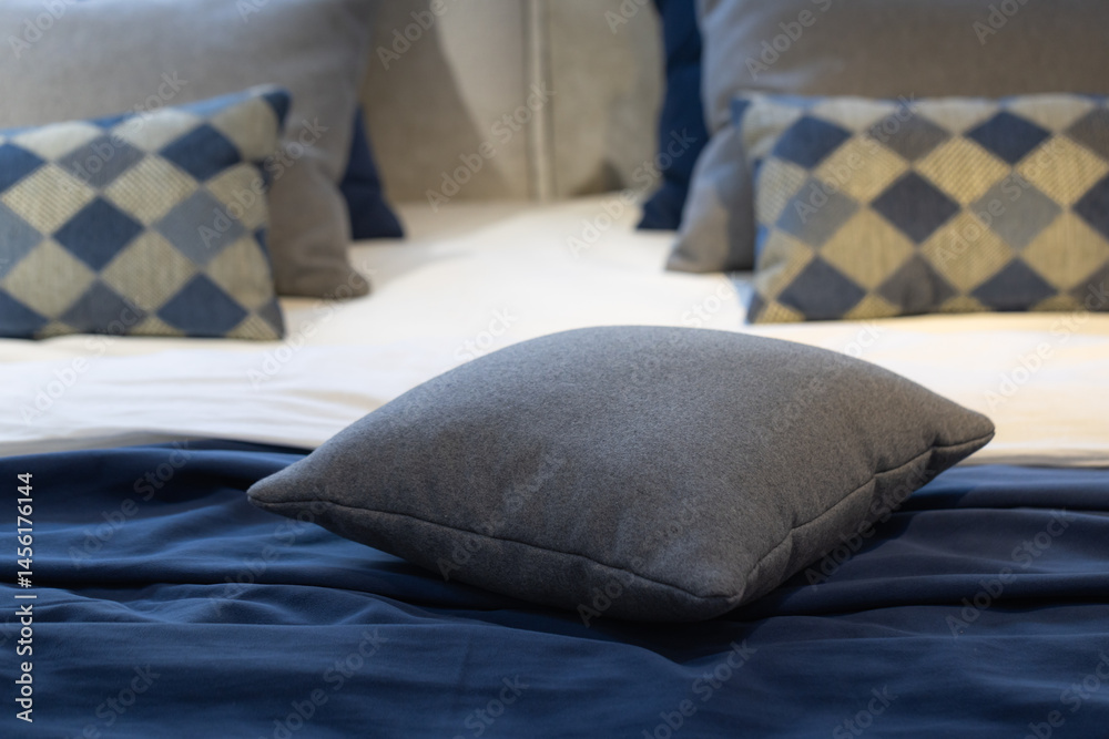 Closeup of cushions on bed