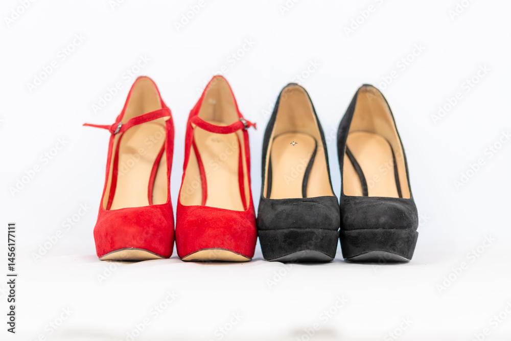 black and red pumps next to each other with a white background black and red pumps next to each other with a white background