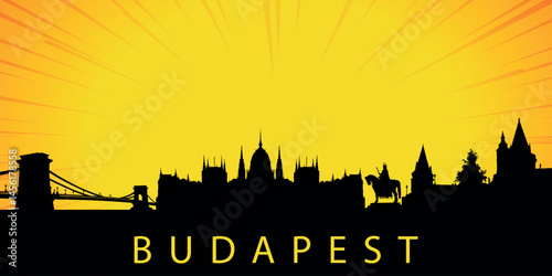 A silhouette of the skyline of Budapest, Hungary against the backdrop of the sunset. The sun is low above the horizon, emitting orange-yellow light with rays that diverge upward.