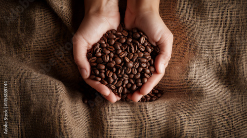 Coffee beans in the hands.