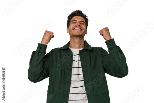 Young handsome caucasian man isolated on white background celebrating a victory, passion and enthusiasm, happy expression.