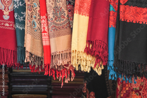 Colorful cashmere cloths with traditional Nepali and Indian patterns are sold in the market shop.