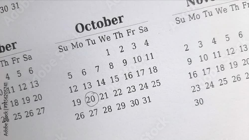 marking 20 October date on the calendar	
