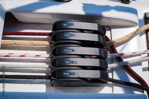 Sailing yacht ropes, stopper and winch. Sailboat equipment details. Water transport, marine travel lifestyle vacation theme.