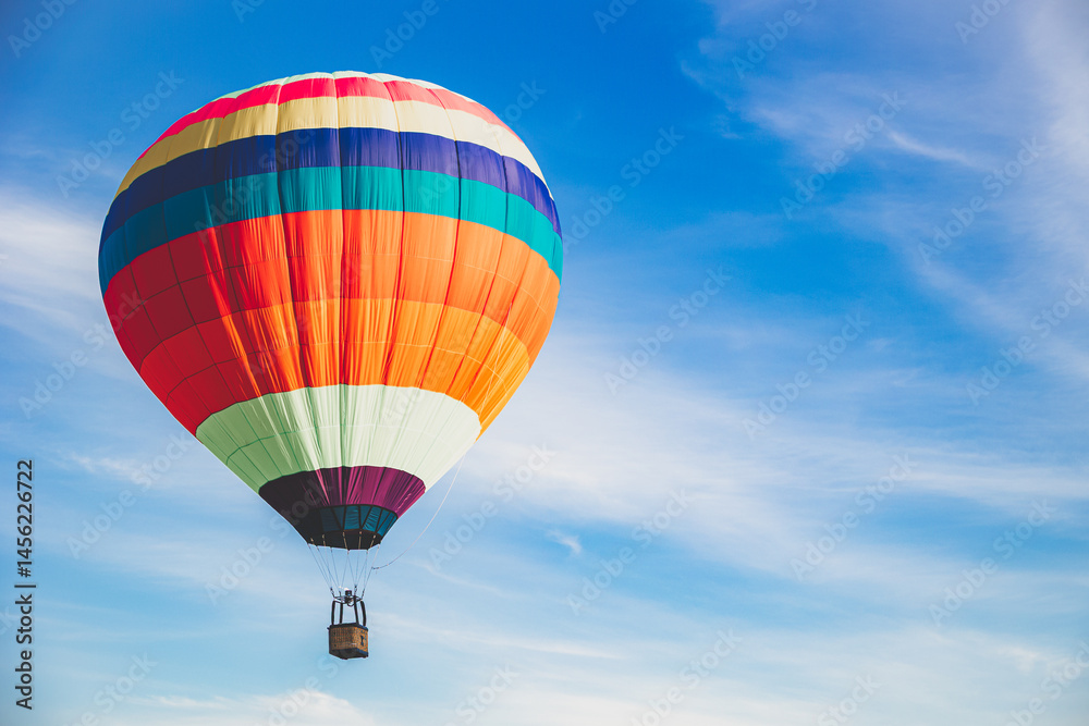 Fototapeta premium Colorful balloon flying on summer sky with copy space for text