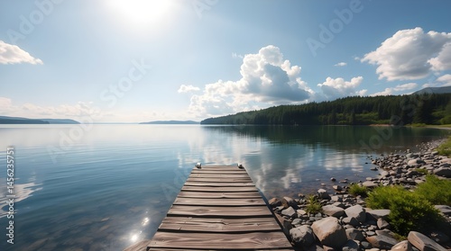 Obraz na płótnie Serene lake view, wooden pier stretching into calm water, mirror-like reflections, vibrant sunset sky, fluffy clouds, lush green shoreline, golden hour lighting, tranquil atmosphere, wide-angle landsc w salonie