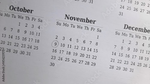 marking 9 November date on the calendar	
