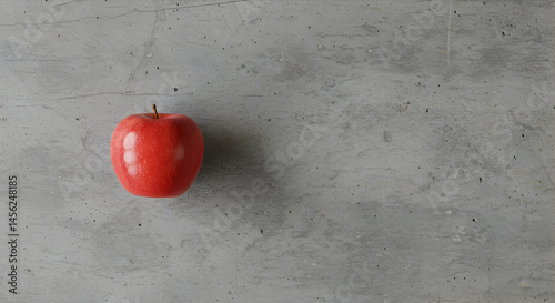 Vibrant Red Apple Against a Textured Neutral Background With Copy Space
