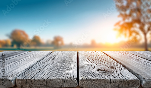 Rustic weathered wooden surface with a nature background, ideal as a product display mockup or text overlay. Perfect for eco-friendly branding, food presentation, or seasonal marketing. photo