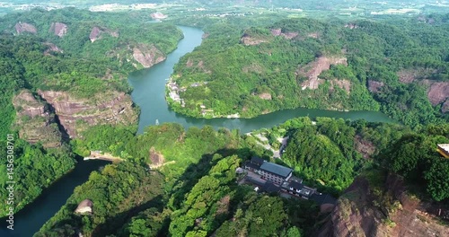 Exploring Guangdong Shaoguan Danxia Mountain through breathtaking aerial shots of lush landscapes and winding rivers