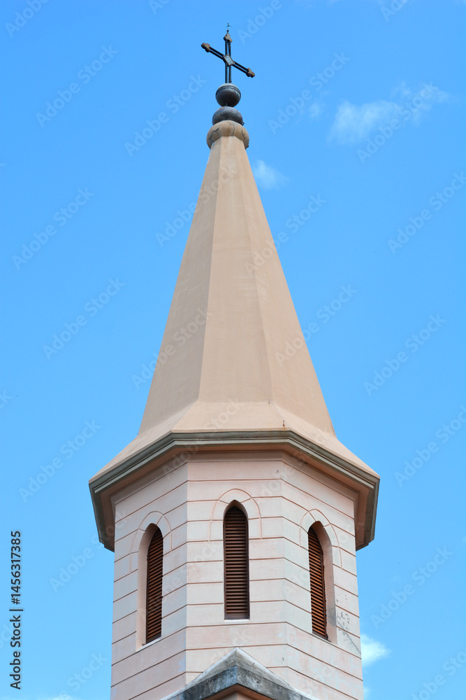 A close-up shot features the bell tower of St. James Church in Jadranovo, topped with a cross against a clear blue sky