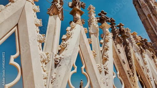 Ornate pinnacles and flying buttresses of Duomo di Milano dominate skyline in Milan, Lombardy, Italy