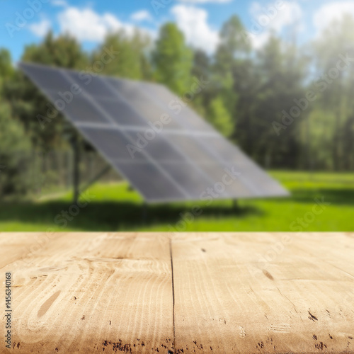 Fototapeta Naklejka Na Ścianę i Meble -  Empty wooden podium with copy space for showcasing eco-friendly or sustainable products and solar panels on lush green field background. Renewable energy and environmental protection concept.