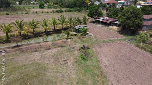 Wallpaper Mural “Aerial View of Rice Fields Behind Rural Thai Homes”
 Torontodigital.ca