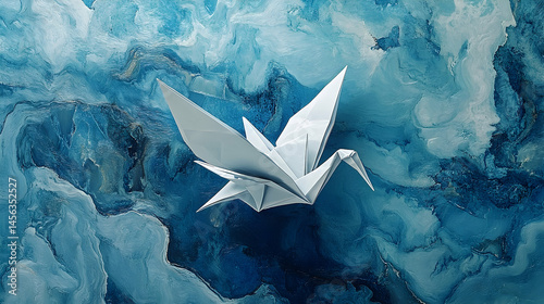 White origami crane on a textured blue abstract background.