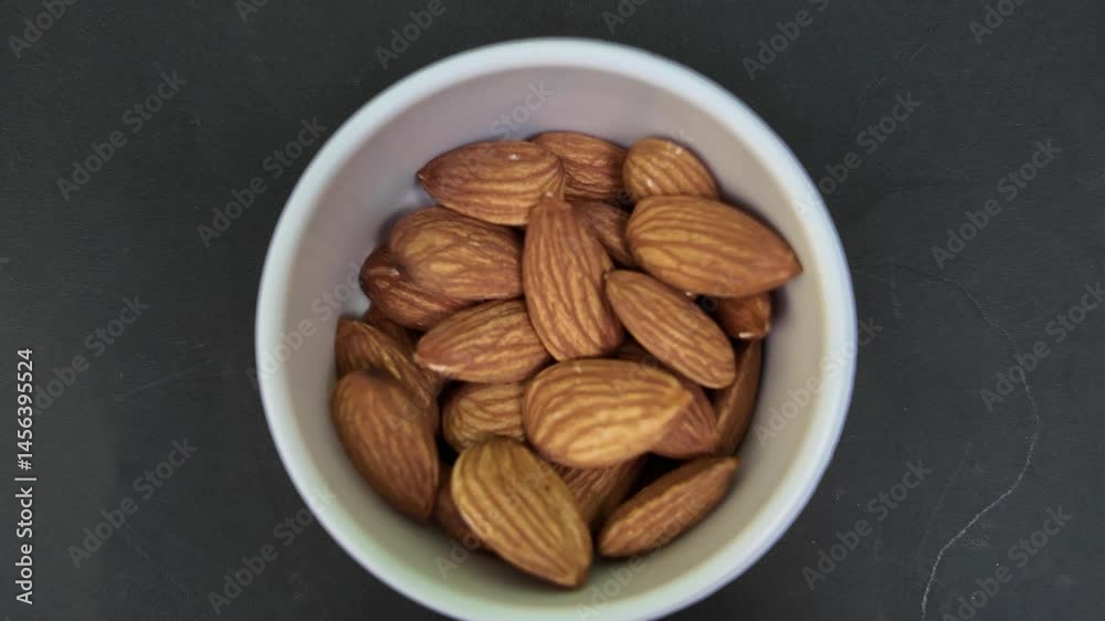 One cup of almonds , in kitchen , pull out scene of almonds