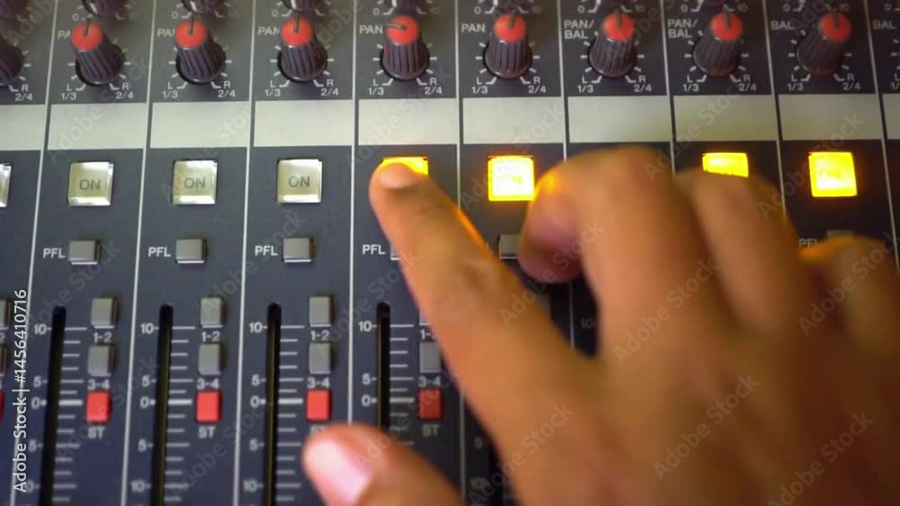 DJ Hands on Mixing Console: Live Music Performance.