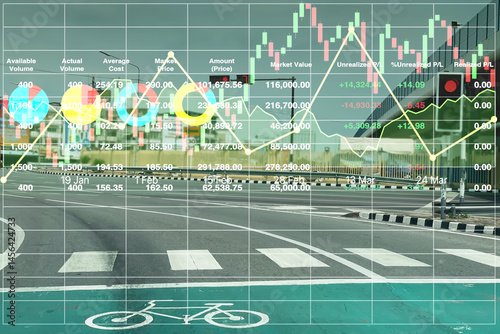 Stock financial image investment data with graph, chart and candlesticks symbol on urban highway image for transportation industry presentation and report background.
