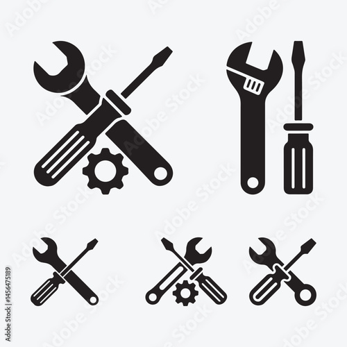Wrench, screwdriver and gear icon silhouette black design.