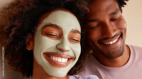 A cheerful man and woman are smiling as they apply a moisturizing foam to their faces, enjoying their skincare routine together in the bathroom