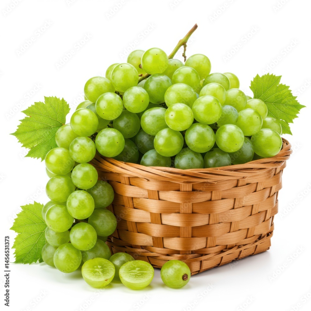 A woven basket overflowing with a generous bunch of fresh green grapes and leaves on white background A woven basket overflowing with a generous bunch of fresh green grapes and leaves on white background