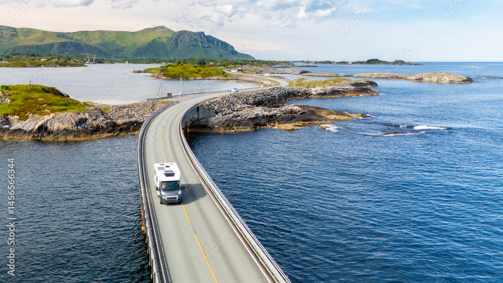 Φωτογραφία Enjoy the breathtaking views of a coastline as a traveler drives a motorhome across a picturesque bridge