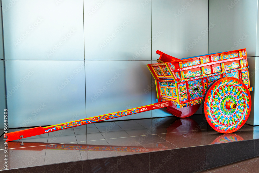 Naklejka premium Colorful old Costa rican trailer wheelbarrow in Alajuela Costa Rica.