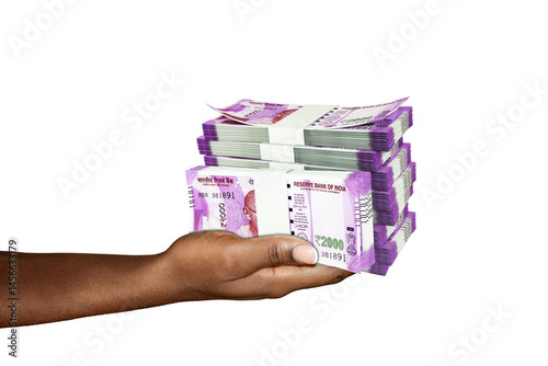 Hand Holding 3D rendering of stacks of 2000 Indian rupee notes isolated on transparent background