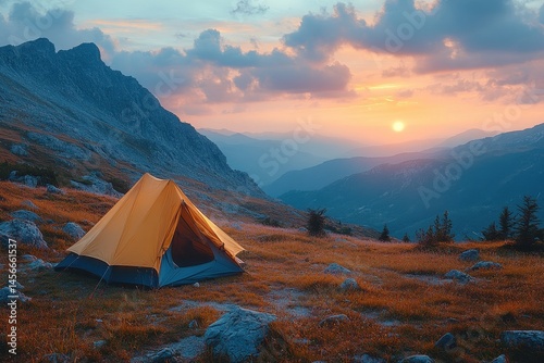 Serene Sunset Over Mountains with Yellow Tent in Scenic Landscape