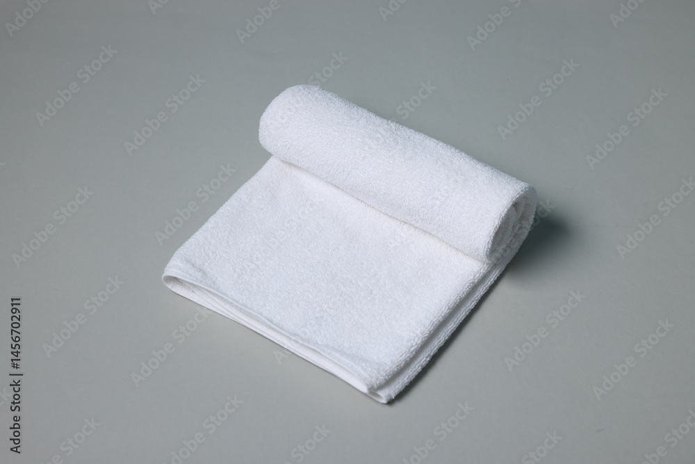 Fototapeta premium One clean terry towel on gray background