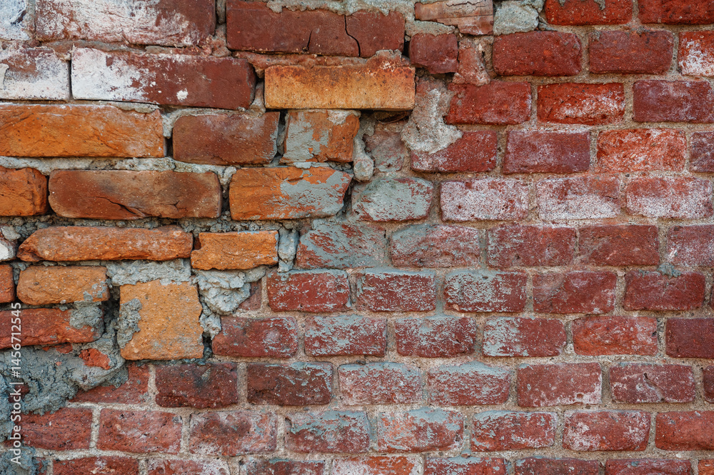 Naklejka premium Old distressed vintage wall bricks background with cracked cement