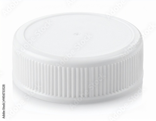 Obraz na płótnie White cap with ribbed sides and flat top, resting on white surface, simple and clean w salonie