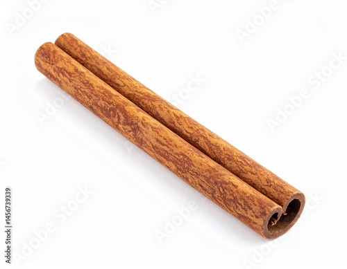 Obraz na płótnie Two cinnamon sticks lie diagonally on a bright white background, showing the textured, brown spice's details. The sticks are rolled w salonie