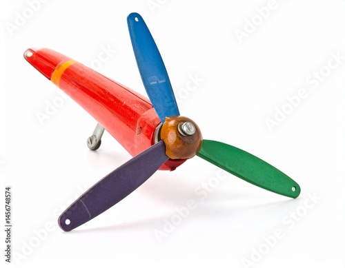 Obraz na płótnie Toy plane with red body and colorful propeller on a white background w salonie
