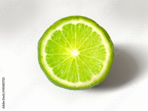 A vibrant, close-up image of a sliced lime, showcasing its juicy inside the fruit