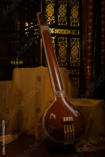Photography Still life photo of Indian musical instrument call as Tanpura or Tambora in a tr