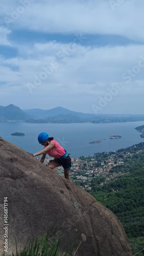 Via Ferrata Picasass, Baveno, Lake Maggiore - Atop a sunlit slope, a climber ascends bare rock high above Lake Maggiore, framed by deep blue waters and sky.