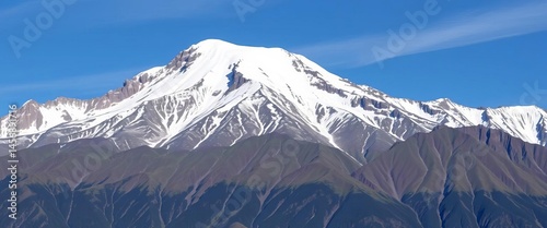 Majestic jade green mountain peak capped with pristine snow, sky, green