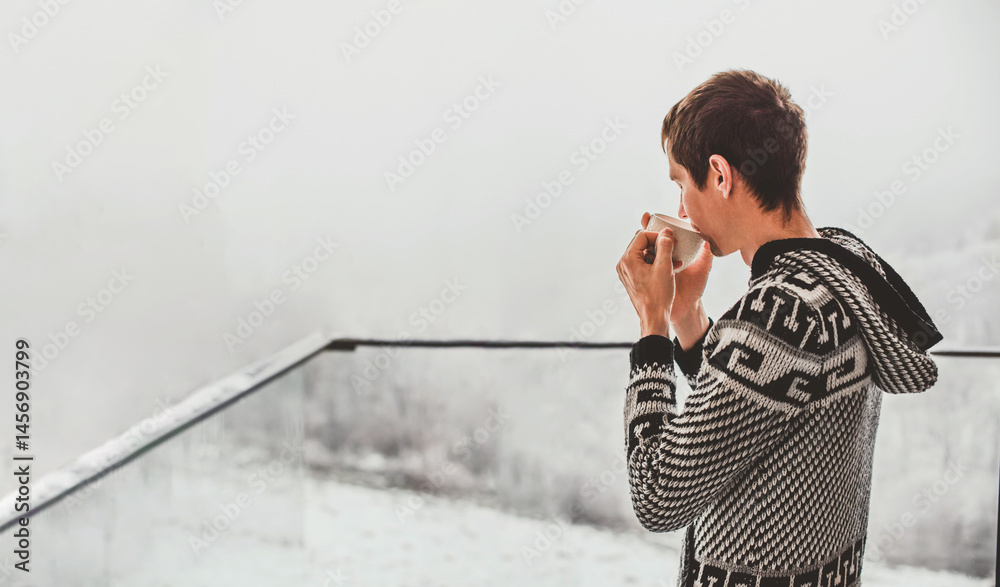 Man Drinking Morning Coffee on Winter Terrace