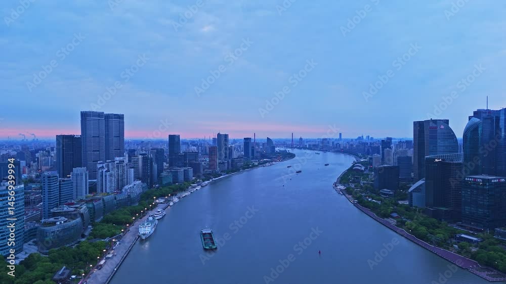 4K real time Aerial view of Shanghai modern buildings along the Huangpu river on the bund at sunrise. 4K real time Aerial view of Shanghai modern buildings along the Huangpu river on the bund at sunrise.