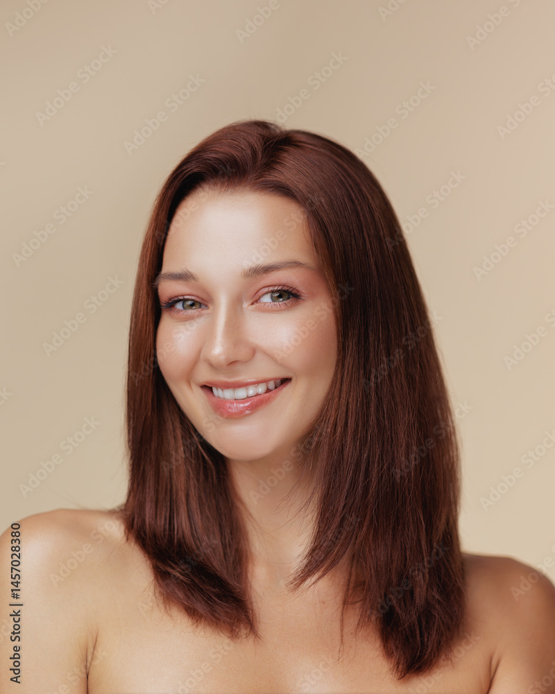 Charming young Caucasian woman with long straight brown hair and radiant smile posing topless in a studio, perfect for beauty, haircare, wellness, and lifestyle brand promotions.