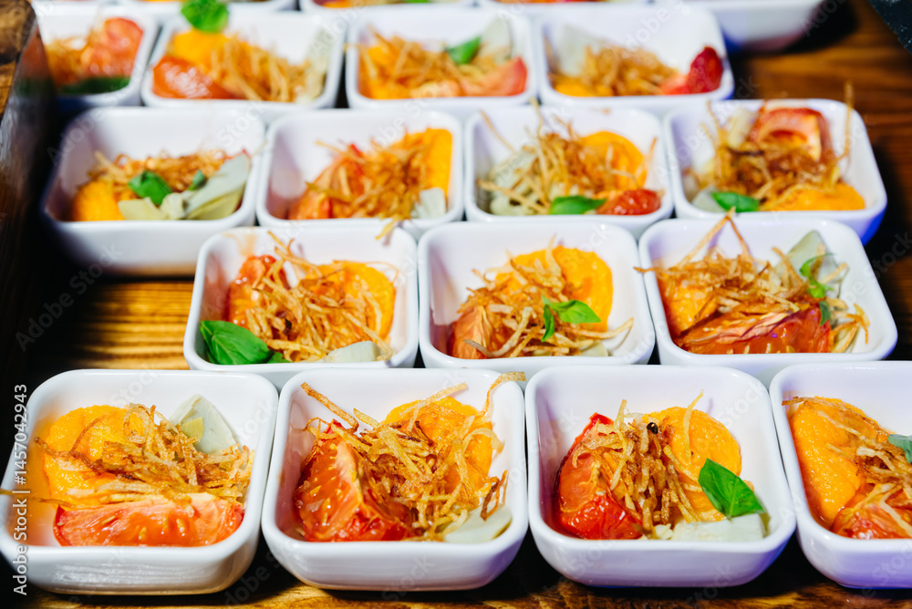 Tomato appetizer with crispy garnish in bowls. Tomato appetizer with crispy garnish in bowls.