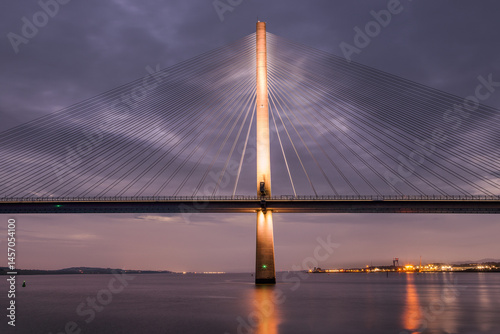 The Queensferry Crossing by night in Scotland.