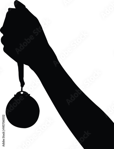 silhouette of a handholding a medal