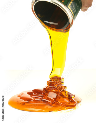 Obraz na płótnie Pouring golden honey on a white background w salonie