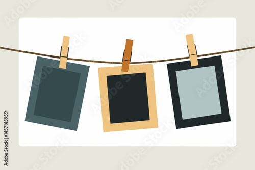 Three Blank Photo Frames Hanging on a Clothesline with Wooden Pegs