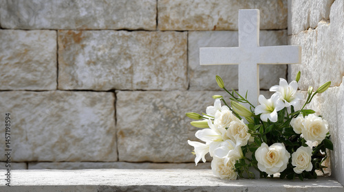 A serene white cross against a textured stone wall, symbol of remembrance photo