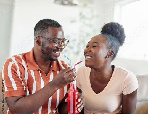 woman couple man happy love young sharing drink straw drinking together romantic cheerful bonding two refreshment dating bonding